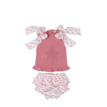 Conjunto combinado ballenas Tony Bambino, top rosa con estrella y lazos, y pantalón con estampado de ballenas.